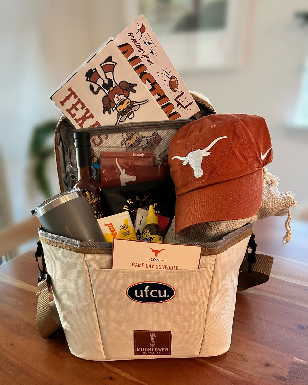 Co-branded UFCU Howdy Kit with Longhorns gear and Austin goods